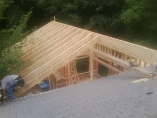 Framing a new roof addition that ties into an existing shingle roof in Christiana